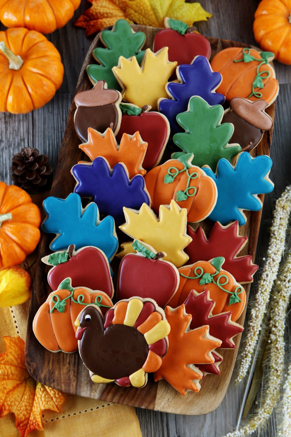 Decorate Thanksgiving cookies.