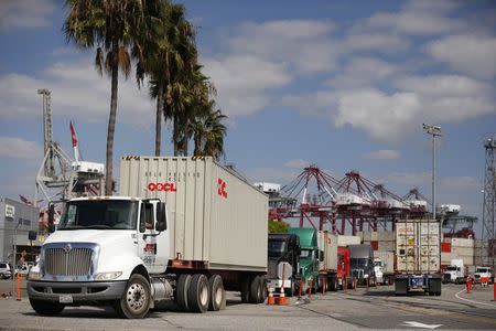 Trucks line up at the Port of Long Beach, in Long Beach, California October 15, 2014. REUTERS/Lucy Nicholson