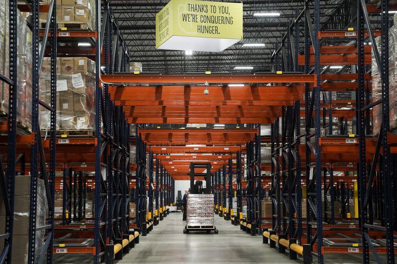 Employees move boxes at the nation's largest food bank warehouse, the Atlanta Community Food Bank, in Atlanta