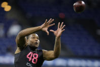 FILE - Georgia defensive lineman Travon Walker catches a pass during a drill at the NFL football scouting combine, Saturday, March 5, 2022, in Indianapolis. Jacksonville, which chose Clemson quarterback Trevor Lawrence last year and is expected to add Michigan pass rusher Aidan Hutchinson, Georgia's Walker or an offensive tackle next, is looking to become the first to say it nailed both selections. (AP Photo/Charlie Neibergall, File)