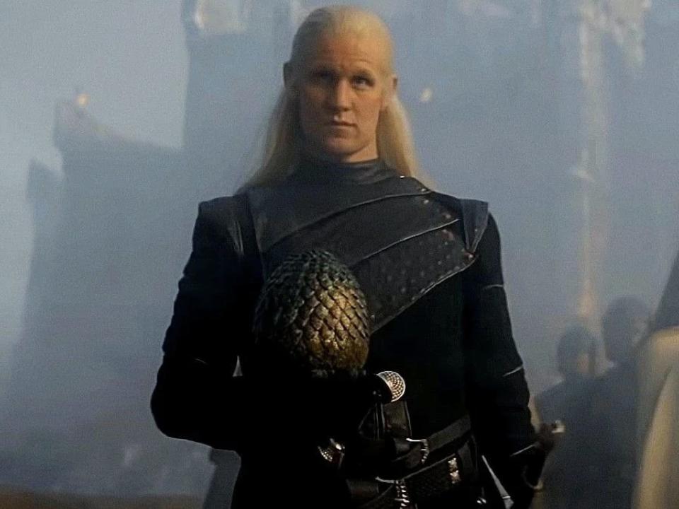 Daemon Targaryen holding a dragon egg