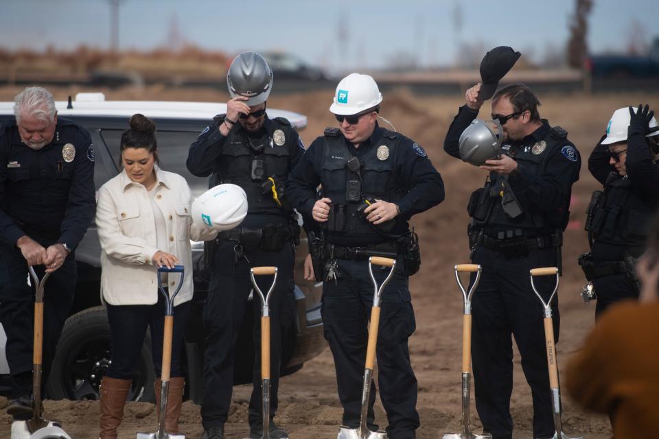 Members of the Timnath Police Department participate in a groundbreaking ceremony Wednesday for their new police station in Timnath.