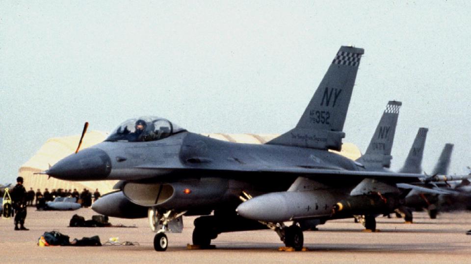 U.S. Air Force F-16s with loaded bombs stand ready to take off in the first daytime raid to liberate Kuwait in 1991.