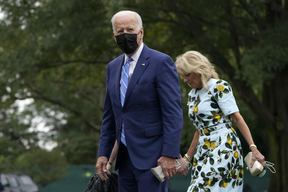 First Lady Jill Biden and President Joe Biden walk together on the White House’s South Lawn. - Credit: AP