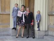 Singer Rod Stewart poses at Buckingham Palace with his wife, Penny Lancaster and children Alastair and Aiden, after receiving a knighthood, in London, Britain, October 11, 2016. REUTERS/Gareth Fulller/Pool