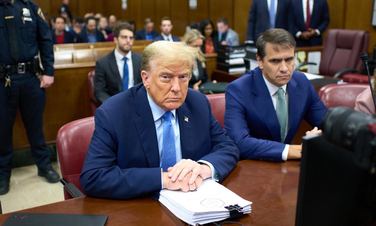 <span>Donald Trump (L) sits in the courtroom next to his attorney Todd Blanche during his hush money trial at Manhattan criminal court in New York, 26 April 2024. </span><span>Photograph: Curtis Means/EPA</span>