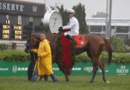 May 5, 2018; Louisville, KY, USA; Mike Smith aboard Justify (7) celebrates after winning the 144th running of the Kentucky Derby at Churchill Downs. Mandatory Credit: Brian Spurlock-USA TODAY Sports