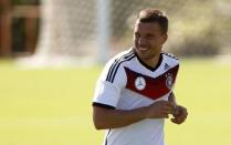 Germany's national soccer team player Lukas Podolski runs during a World Cup 2014 training session in the village of Santo Andre, north of Porto Seguro, June 17, 2014. REUTERS/Arnd Wiegmann