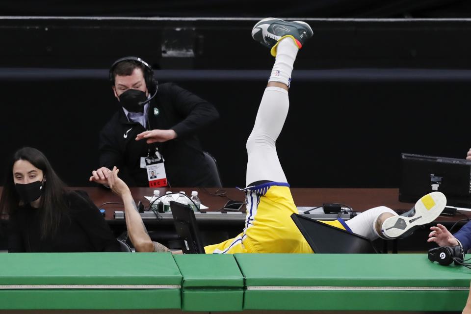 Golden State Warriors' Juan Toscano-Anderson goes out of bounds after chasing the ball during the second half of an NBA basketball game against the Boston Celtics, Saturday, April 17, 2021, in Boston. (AP Photo/Michael Dwyer)