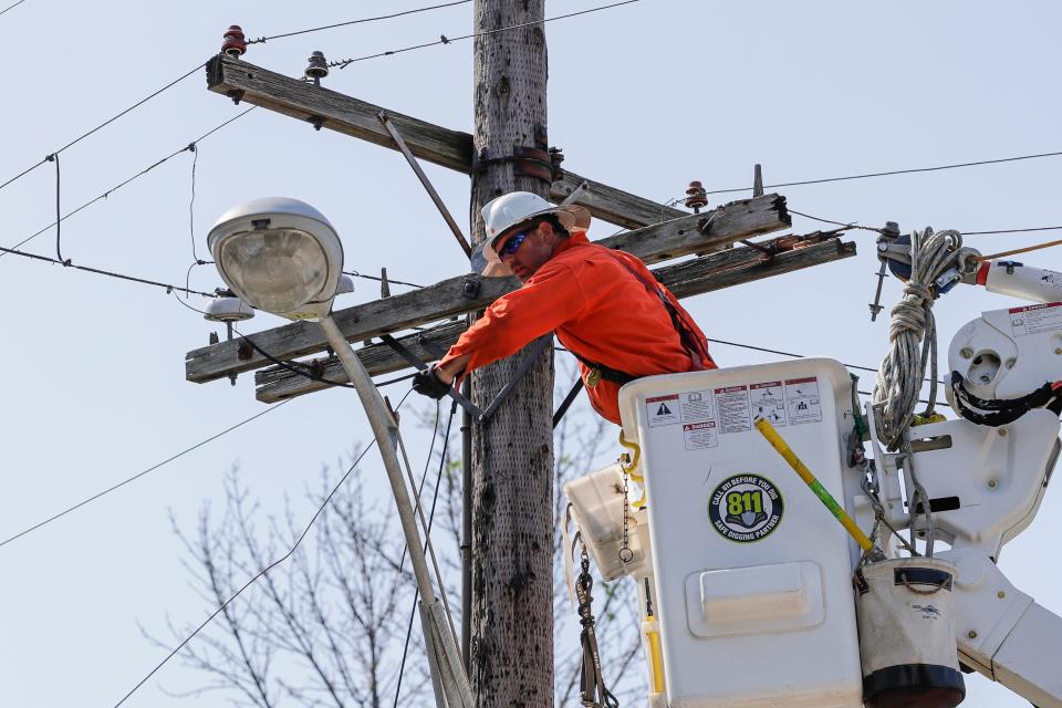 WPS works to restore power in  the 800 block of 13th Avenue on July 23, 2019, in Green Bay, Wis.