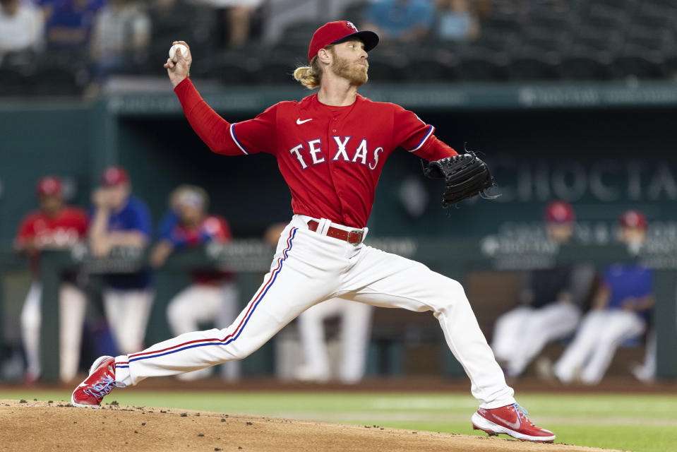 Texas Rangers starting pitcher Mike Foltynewicz (20) throws during the first inning of a baseball game against the Minnesota Twins in Arlington, Texas, Friday, June 18, 2021. (AP Photo/Andy Jacobsohn)