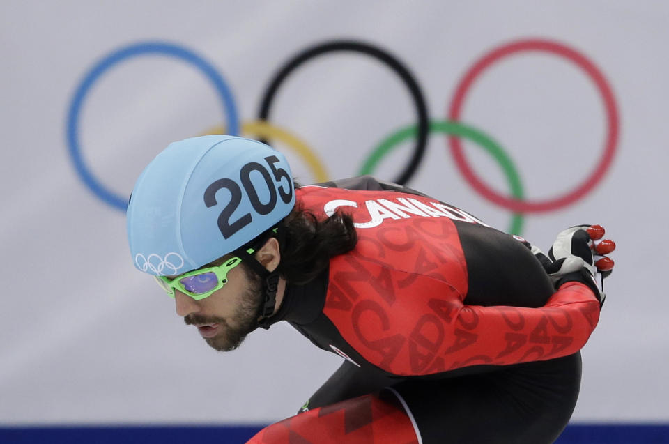 Charles Hamelin of Canada competes in a men's 1500m short track speedskating final at the Iceberg Skating Palace during the 2014 Winter Olympics, Monday, Feb. 10, 2014, in Sochi, Russia. (AP Photo/Darron Cummings)