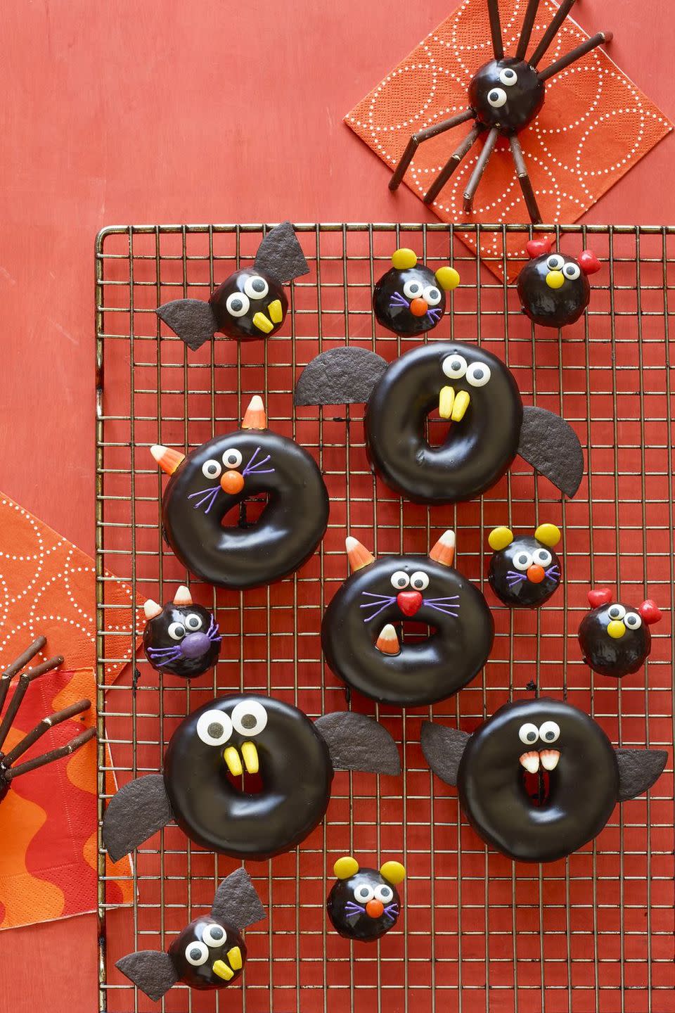 <p>Kids will swarm around this chocolate-dipped dessert that's frightfully cute.<br></p><p>Get the <strong><a href="https://www.womansday.com/food-recipes/food-drinks/a23460042/black-cat-bat-spider-and-mice-doughnuts-recipe/" rel="nofollow noopener" target="_blank" data-ylk="slk:Black Cat, Bat, Spider, and Mice Doughnut recipe" class="link ">Black Cat, Bat, Spider, and Mice Doughnut recipe</a></strong><strong>.</strong><em><strong><br></strong></em></p>