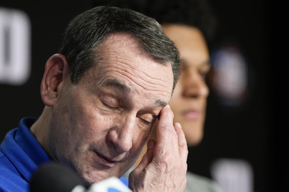 Duke head coach Mike Krzyzewski wipes his face during a news conference after Duke's loss against North Carolina during a college basketball game in the semifinal round of the Men's Final Four NCAA tournament, Saturday, April 2, 2022, in New Orleans. (AP Photo/David J. Phillip)