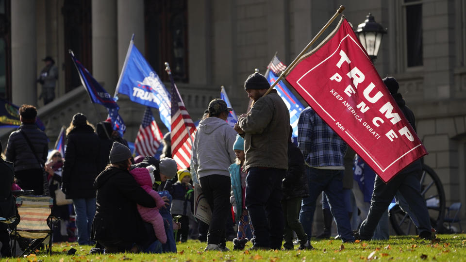 President Trump supporters rally at the Capitol building in Lansing, Mich., Saturday, Nov. 14, 2020. (AP Photo/Paul Sancya)