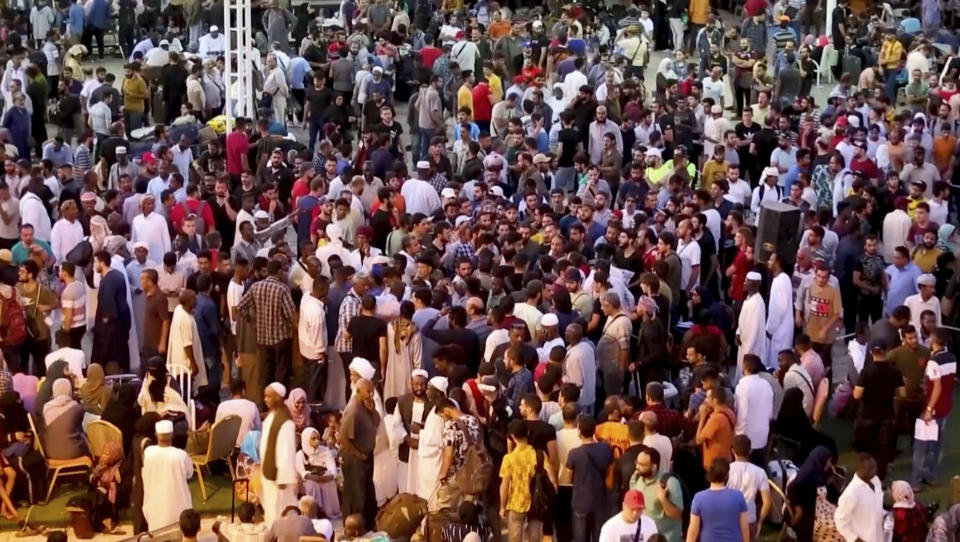 CORRECTS DATE In this screen grab taken from video, Sudanese and foreigners arrive in Port Sudan, the country's main seaport, as they wait to be evacuated out of Sudan, Saturday April 29, 2023. Sudanese fleeing the fighting between rival generals in their capital flooded an already overwhelmed city on the Red Sea and Sudan’s northern borders with Egypt, as explosions and gunfire echoed Tuesday in Khartoum. (AP photo/Smowal Abdalla)