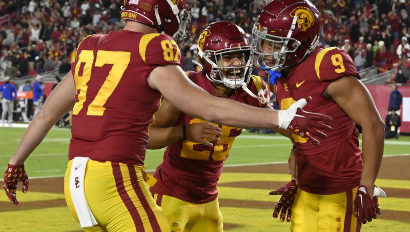 Southern California tight end Lake McRee, from left, defensive back Briton Allen (25) and wide receiver Michael Jackson III celebrate a touchdown against California during the first half of an NCAA college football game Saturday, Nov. 5, 2022, in Los Angeles.