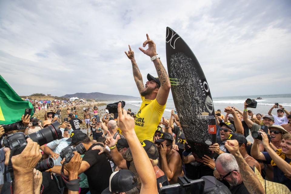 Filipe Toledo celebrates with fans after winning his first WSL title at Lower Trestles in San Clemente.