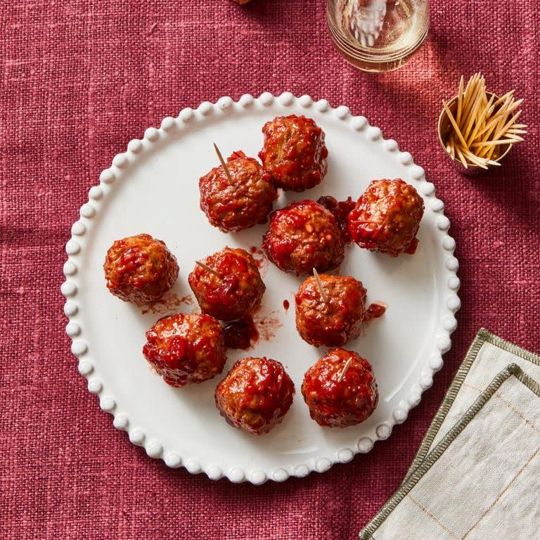 <p>Meatballs are a classic party appetizers, and for good reason. These ones get an upgrade thanks to the cranberry sauce and brown sugar. </p><p>Get the <a href="https://www.goodhousekeeping.com/food-recipes/a37051931/sweet-and-sour-meatballs-recipe/" rel="nofollow noopener" target="_blank" data-ylk="slk:Sweet and Sour Meatballs recipe;elm:context_link;itc:0;sec:content-canvas" class="link "><strong>Sweet and Sour Meatballs recipe</strong></a>. </p>