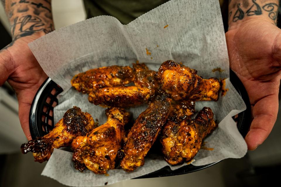 The twice-baked, cast-iron chicken wings make for a popular starter at the new Bucks Coal Fired Pizza in North Palm Beach.