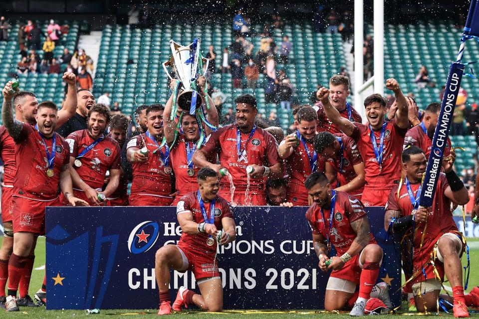 <p>Toulouse’s Antoine Dupont lifts the Heineken Champions Cup trophy at Twickenham</p> (Getty Images)