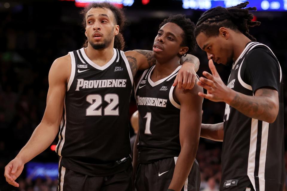 Friars Devin Carter (22), Jayden Pierre (1) and Corey Floyd Jr. (14) react during the second half against Marquette Friday night at Madison Square Garden. The Friars will learn their NCAA Tournament fate on Sunday night.