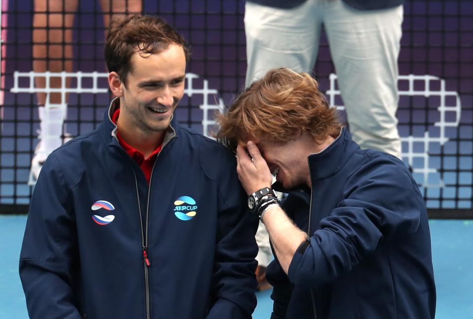 Andrey Rublev (right) and Daniil Medvedev laugh after winning the 2021 ATP Cup.