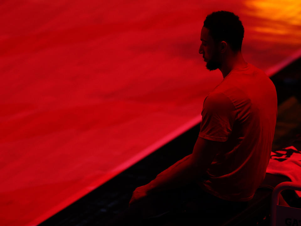 Ben Simmons sits on the sidelines during his final days in a Philadelphia 76ers uniform. (Kevin C. Cox/Getty Images)