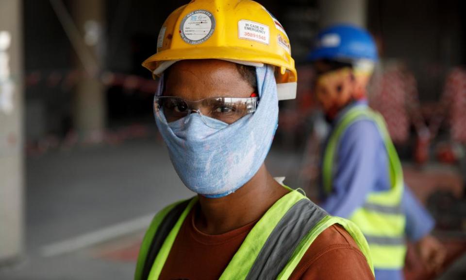 A migrant worker at the construction site for the Al Rayyan stadium exactly four years before the start of the World Cup