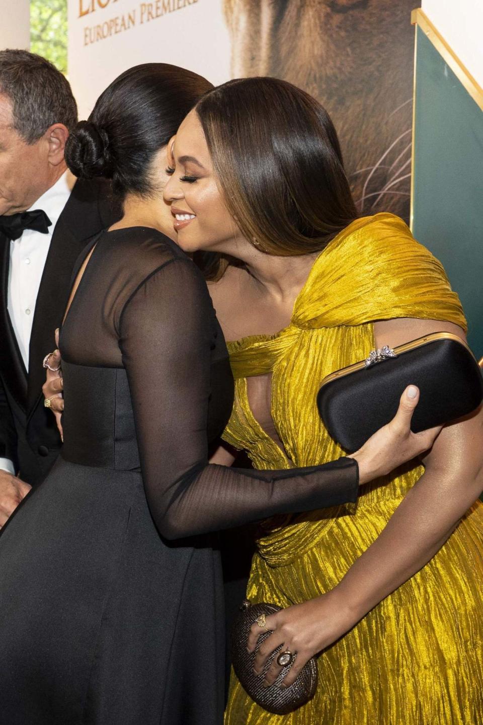 Meghan Markle and Beyoncé embracing at The Lion King premiere in London (AFP/Getty Images)