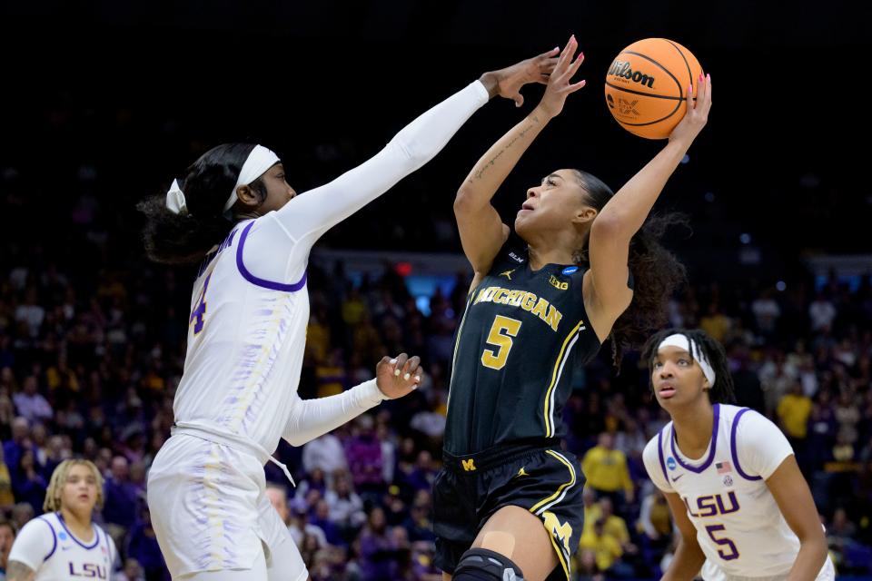 Michigan guard Laila Phelia shoots against LSU guard Flau'jae Johnson during the first half of a NCAA tournament game in Baton Rouge, Louisiana, on Sunday, March 19, 2023.