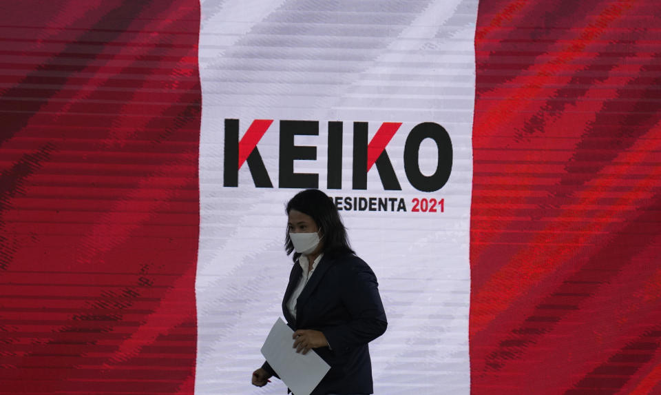 Presidential candidate Keiko Fujimori arrives for a press conference in Lima, Peru, Wednesday, June 0, 2021. Peruvians are still waiting to learn who will become their president next month as votes from Sunday's runoff election continued to be counted and the tiny difference between the two candidates, Fujimori and Pedro Castillo, has narrowed. (AP Photo/Martin Mejia)