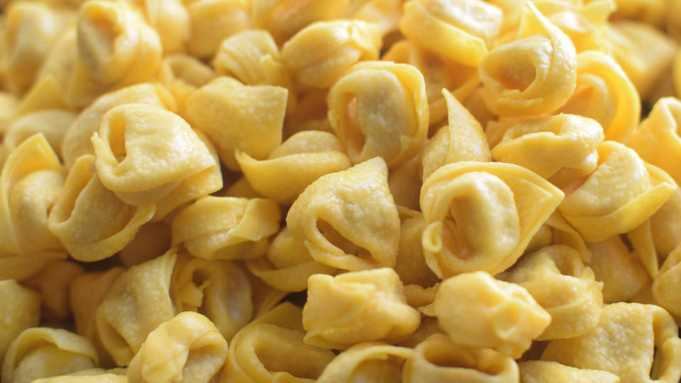 Close-up view of uncooked tortellini pasta
