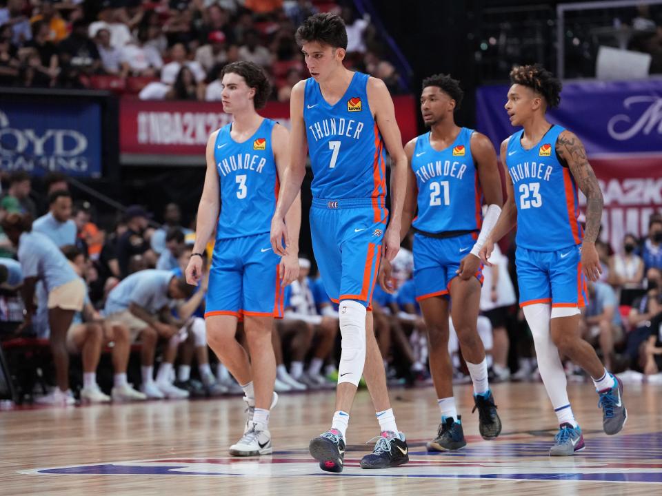 Rookie Chet Holmgren (7) leads Thunder teammates Josh Giddey (3), Aaron Wiggins (21) and Tre Mann (23) across the floor during an NBA Summer League game against the Rockets at Thomas & Mack Center in Las Vegas on July 9.