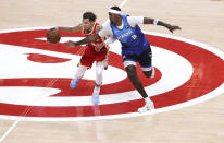 Atlanta Hawks guard Trae Young draws a foul from Milwaukee Bucks forward Bobby Portis during the second quarter in Game 3 of the NBA Eastern Conference basketball finals, Sunday, June 27, 2021, in Atlanta. (Curtis Compton/Atlanta Journal-Constitution via AP)