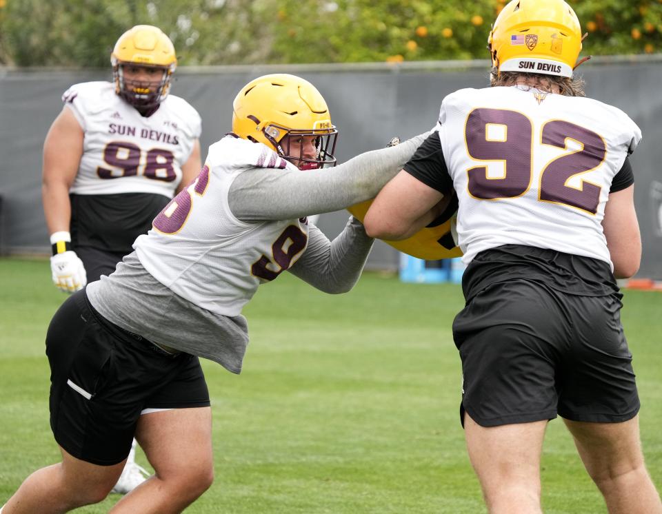 Arizona State Sun Devils defensive linemen Anthonie Cooper and Sam Benjamin train during spring football practice at the Kajikawa practice fields in Tempe on March 16, 2023.