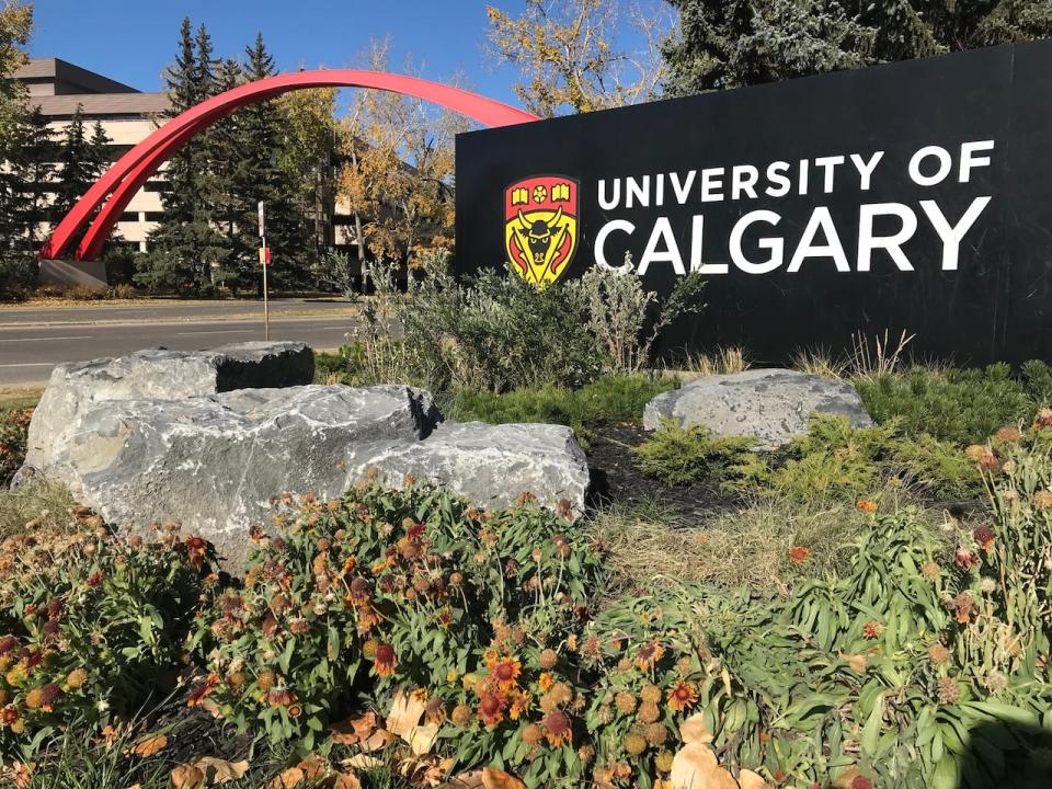 The University of Calgary sign is pictured at the campus entrance, on a sunny fall day. 