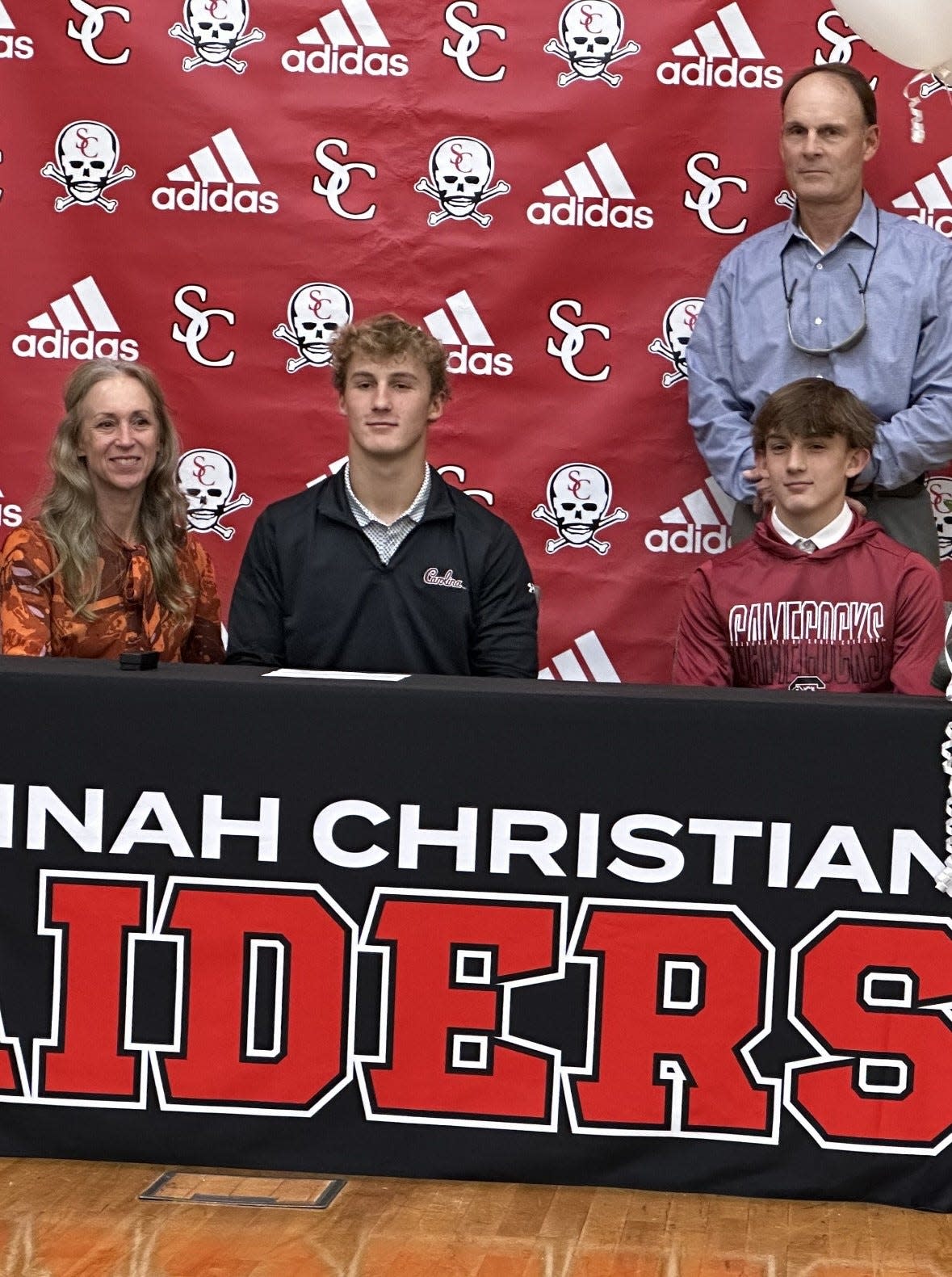 David Bucey of Savannah Christian, pictured with his family, celebrated his upcoming signing to play football at South Carolina Wednesday. He will officially sign with the Gamecocks in December.