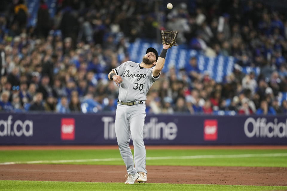 Chicago White Sox third baseman Jake Burger (30) makes a catch for an out on a fly ball hit by Toronto Blue Jays' Daulton Varsho during the second inning of a baseball game in Toronto, Wednesday, April 26, 2023. (Andrew Lahodynskyj/The Canadian Press via AP)