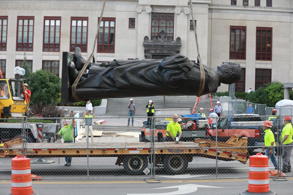 Workers remove the Christopher Columbus statue on the Broad Street side of Columbus City Hall Wednesday, July 1, 2020.