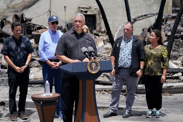 Maui Country Mayor Richard Bissen speaks as Sen. Brian Schatz (D-Hawaii), President Joe Biden, Hawaii Gov. Josh Green and his wife Jaimie, listen after Biden toured areas devastated by the Maui wildfires on Aug. 21. 