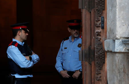 Mossos d'Esquadra, Catalan regional police officers, stand guard outside the Generalitat Palace, the Catalan regional government headquarter in Barcelona, Spain, October 30, 2017. REUTERS/Yves Herman