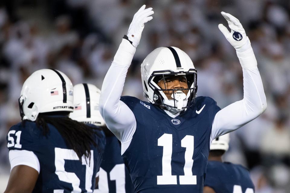 Penn State linebacker Abdul Carter (11) motions to the crowd during a White Out game against Iowa Saturday, Sept. 23, 2023, in State College, Pa. Carter, a sophomore, has recorded 11 total tackles, one sack and one interception through the first four games of the season.