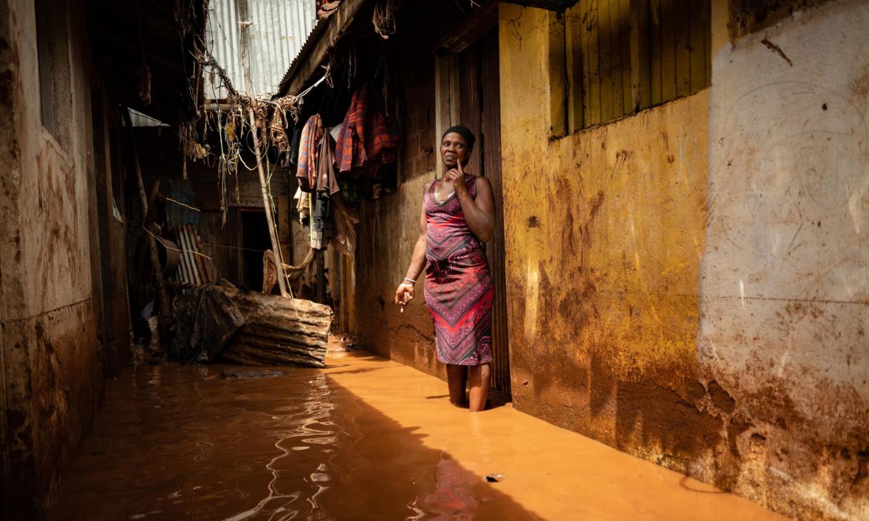 <span>Jane Kalekye stands outside her home in the Mathare slum in Nairobi, which has been flooded almost every night as El Niño rains devastate Kenya. </span><span>Photograph: Edwin Ndeke/The Guardian</span>