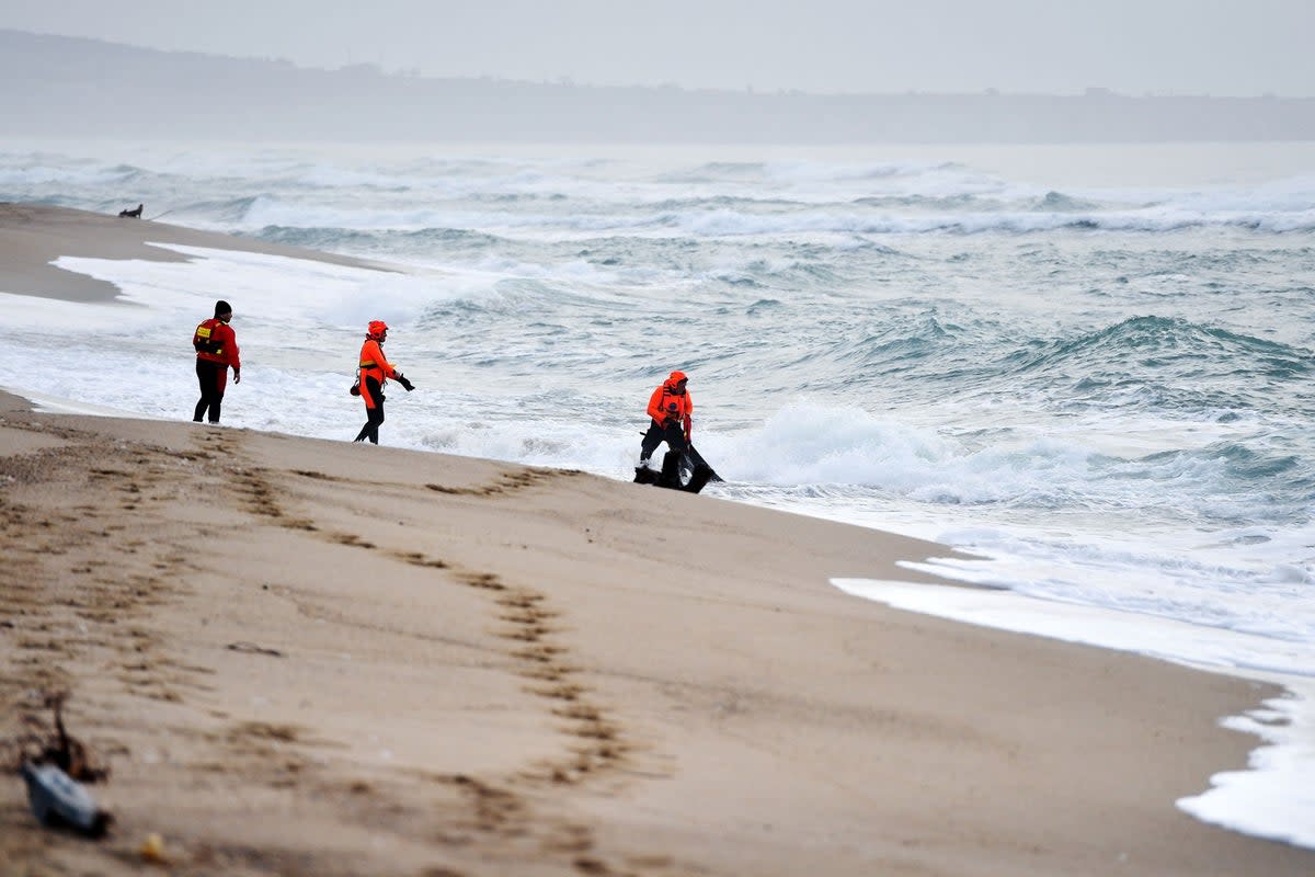 Italian costguard at the scene (AFP via Getty Images)