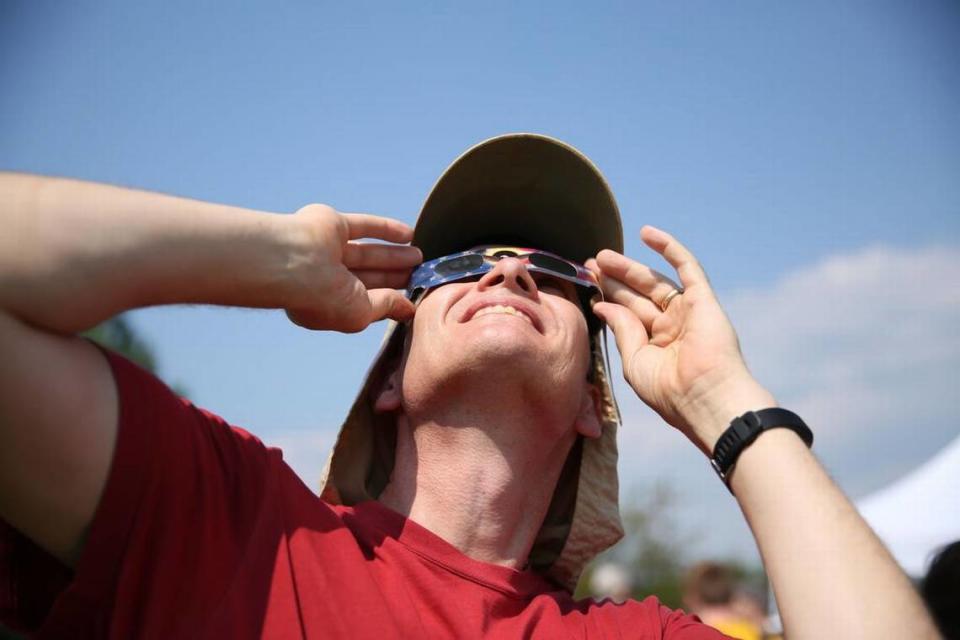 Chip Clark looks at the eclipse Monday, Aug. 21, 2017 at The Arboretum at Penn State.