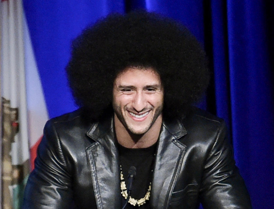 Is Colin Kaepernick really close to signing with a team? (Photo by Richard Shotwell/Invision/AP)