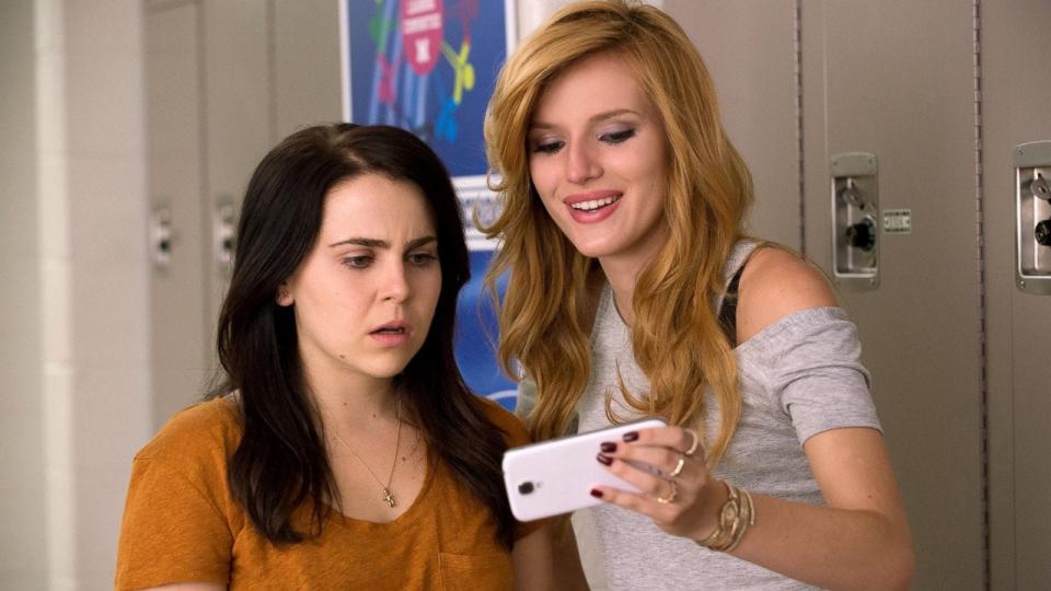 Mae Whitman and Bella Thorne looking at a phone
