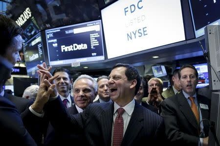 First Data Chairman and Chief Executive Frank Bisignano (C) celebrates during his company's initial public offering on the floor of the New York Stock Exchange October 15, 2015. REUTERS/Brendan McDermid