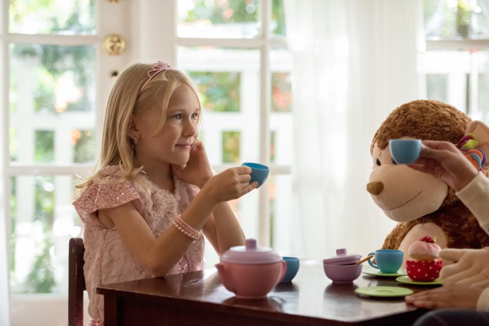 Bailey having a tea party with stuffed animals